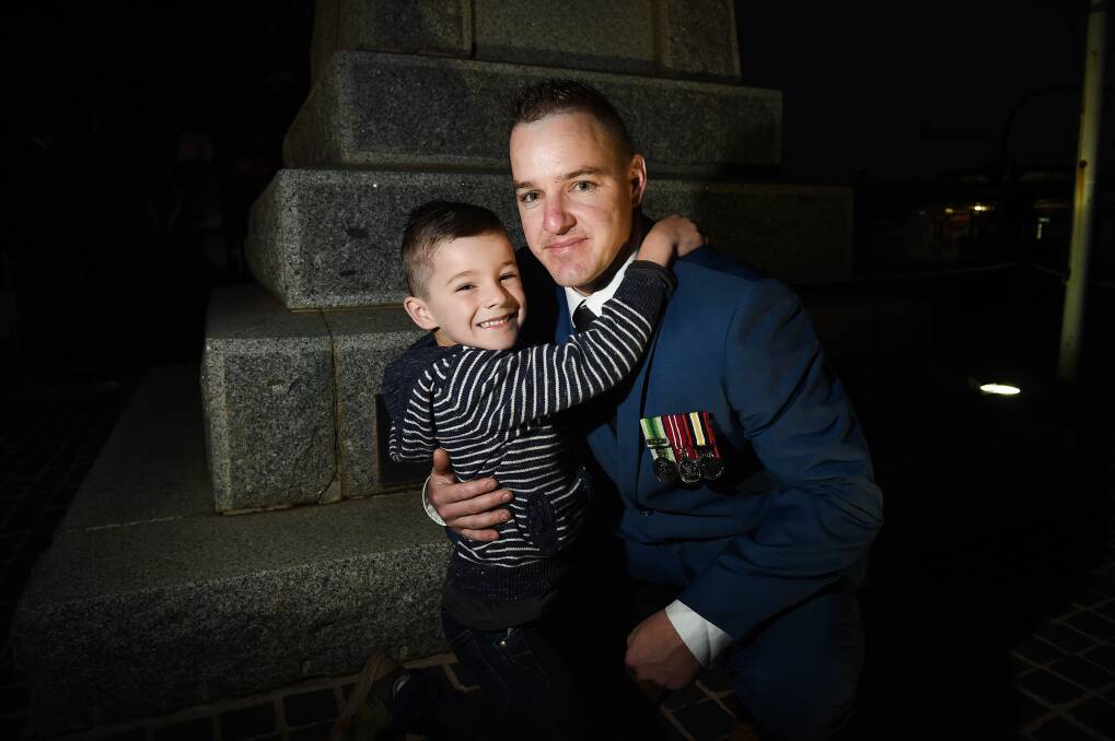 HERE TO SERVE: Jamie Wolf, with his son Declan, 6, in 2019, has led a one-man mission to support fire-affected people.