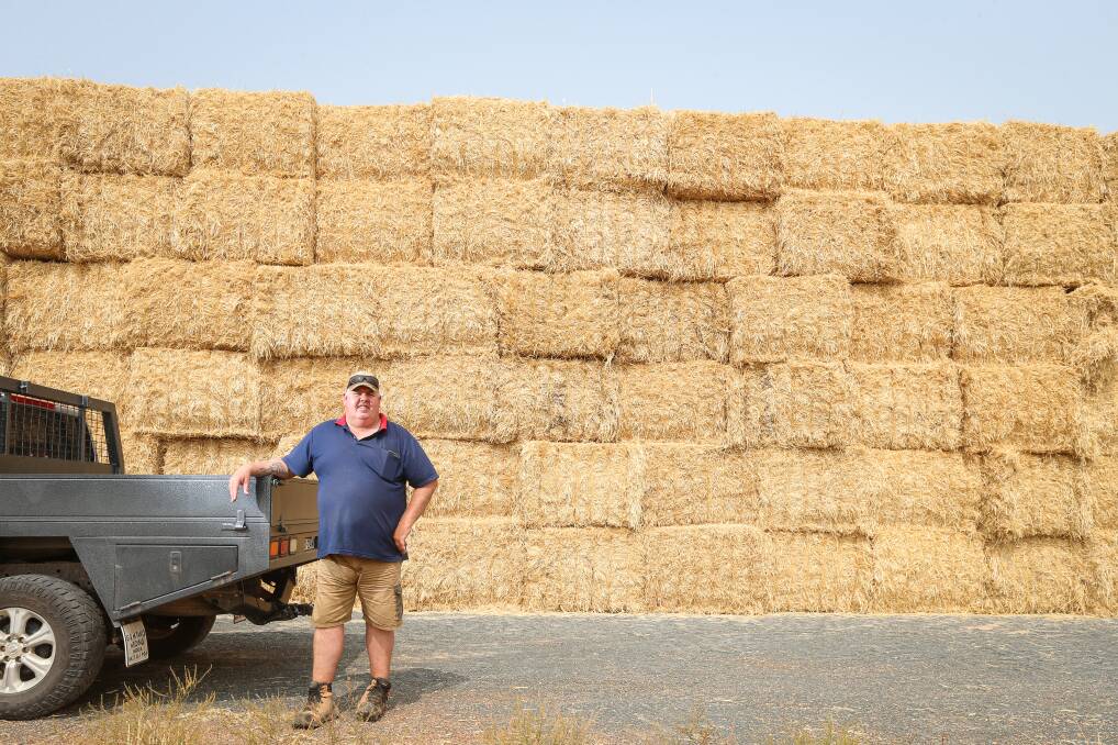 EVERY BIT HELPS: Walla's Jason Schilg has helped co-ordinate stubble to be cut for hay that will be sent to fire-affected farmers in the Upper Murray. Picture: JAMES WILTSHIRE