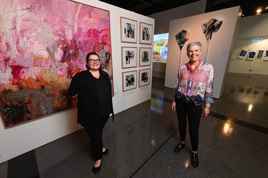 ART IN AG: Albury Library Museum exhibition curator Kate Eastick with Earth Canvas's Gillian Sanbrook. PIcture: MARK JESSER