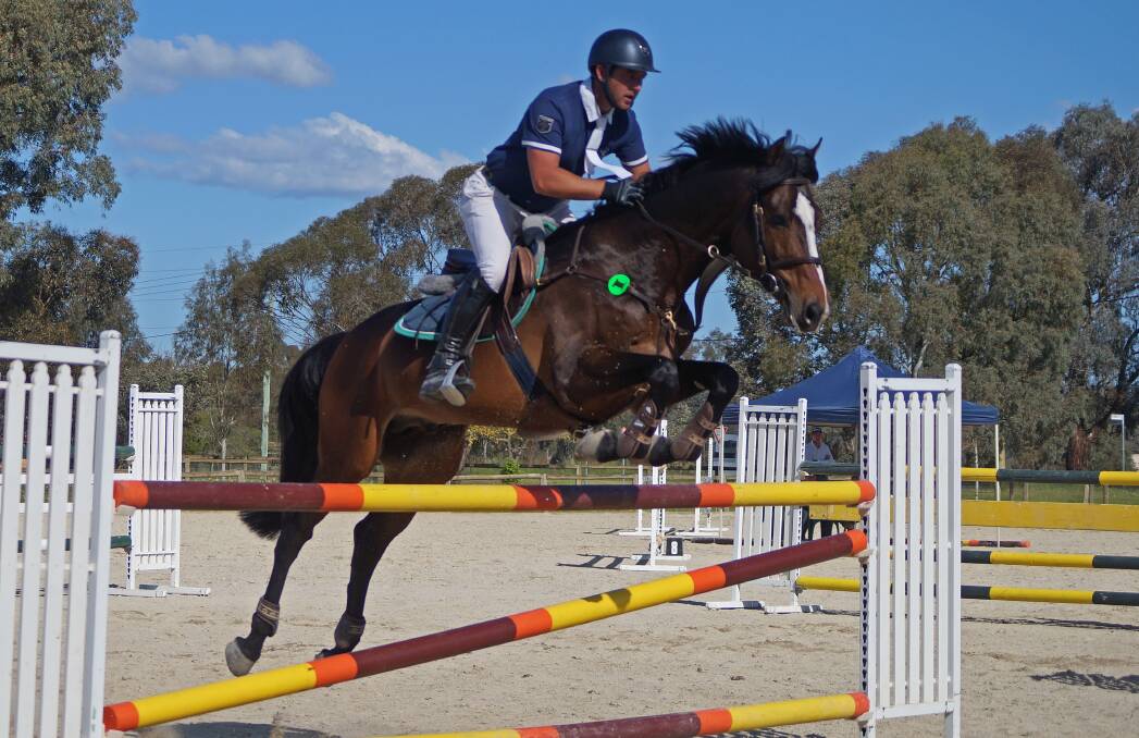 HIGH FLYER: Scottie Barclay and Luchia Elmare show their style over a jump which saw the pair claim the 1.25-metre class in the BDSJC pop-up show.