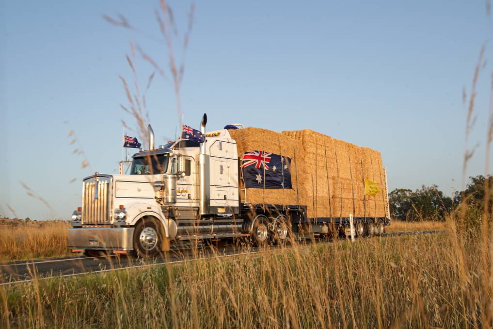 WARM WELCOME: The Burrumbuttock Hay Runners convoy generated huge interest among the public as it travelled up the freeway during the Australia Day weekend. Picture: JAMES WILTSHIRE