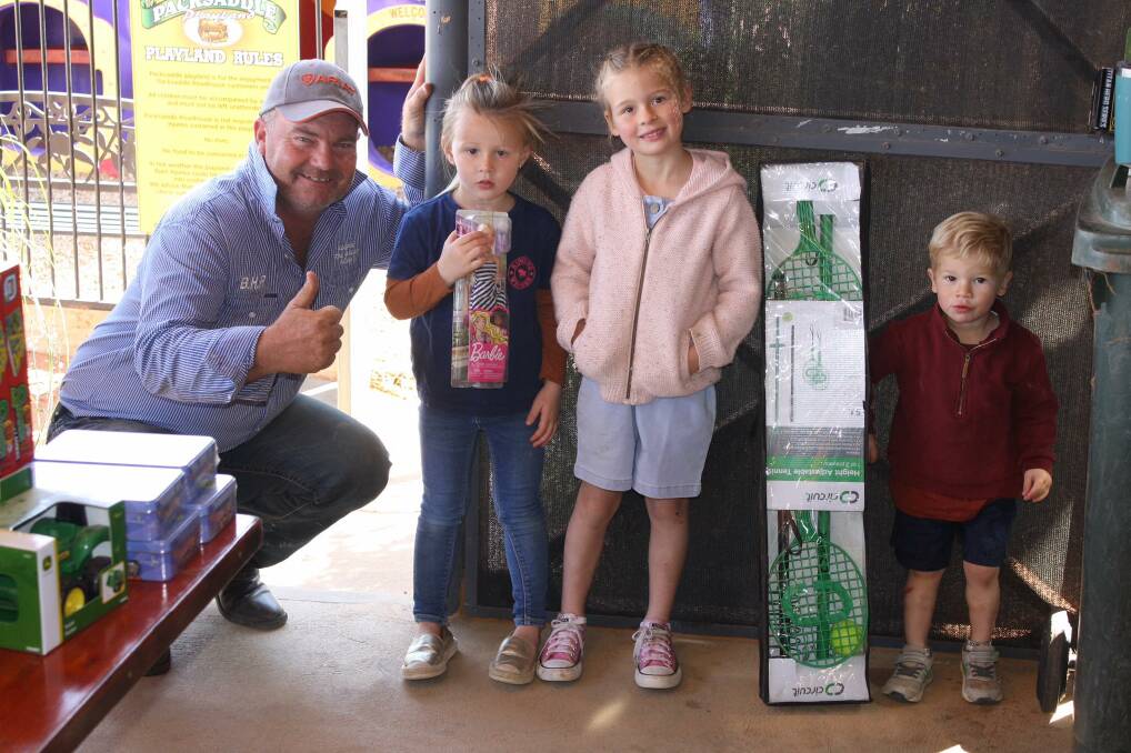 TOYS AND A TONNE OF FUN: Burrumbuttock Hay Runners chief Brendan Farrell with children at Packsaddle, NSW as part of an outback toy run. Picture: SUPPLIED