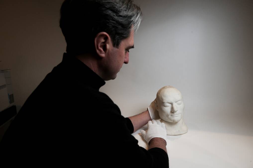 Burke Museum and cultural heritage manager Cameron Auty with Ned Kelly's death mask.