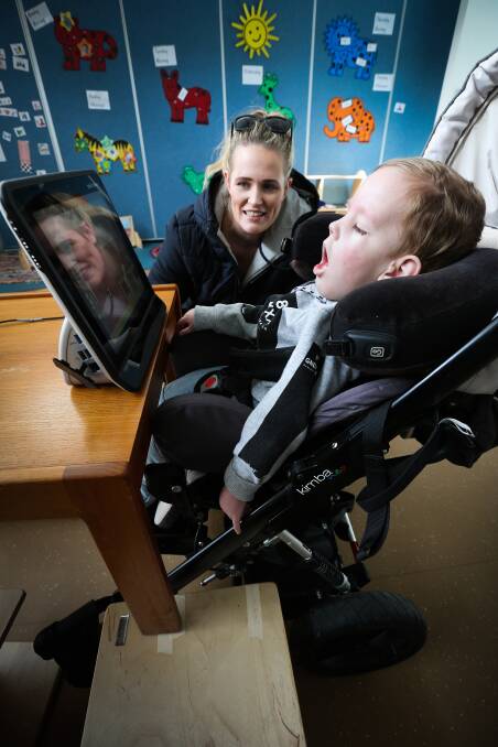 NEW FOCUS: Corowa's Alli Henderson helps her son Knox, 2, use the new eye gaze computer through Aspire Early Intervention. PIctures: KYLIE ESLER