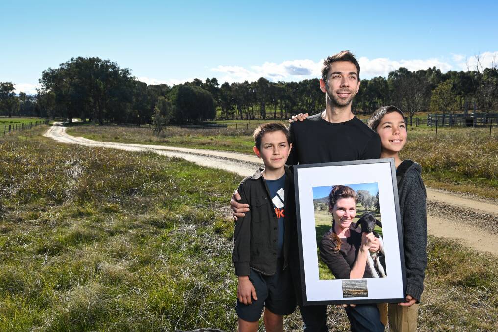 THE ROAD HOME: Talgarno father of four James Filby with sons Ari, 12 and Lawson, 11, on the newly named road to their home, 'Danelle Lane', which honours devoted wife and mother Danelle Filby. Picture: MARK JESSER
