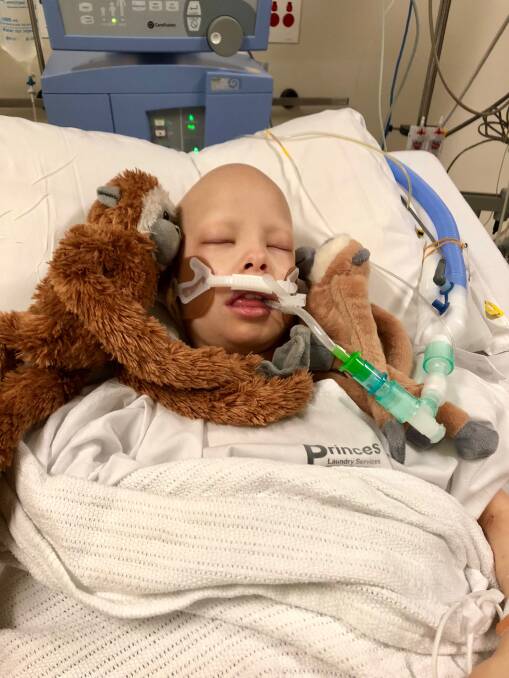 FRIEND INDEED: Matilda Hacking's monkey Swinggles stays close after the gruelling lung surgery. Picture: SUPPLIED