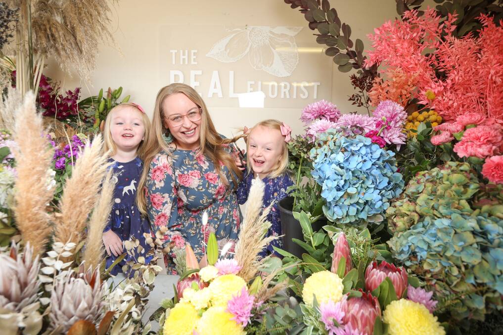 MAKE IT COUNT: The Real Florist owner Renee Williams, pictured with daughters, Amelia, 3, and Marlie, 6, is raising money for the Border Trust for Mother's Day and during May. Picture: JAMES WILTSHIRE