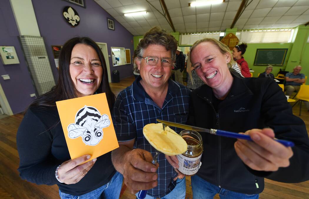 OH HONEY: US-born singer Toni Childs with beekeeper Russell Holland and Wild Pollinator Count's Karen Retra. Picture: MARK JESSER