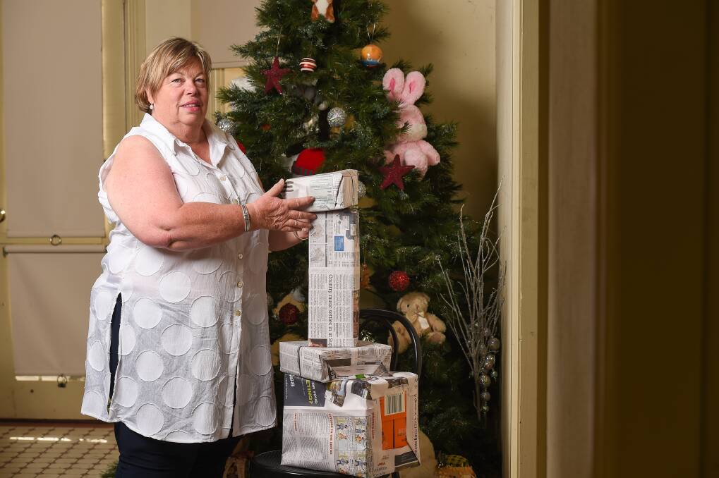 STACKING UP: Volunteer Marylou Hodges says shoeboxes filled with pamper items for rural women are steadily mounting up for the Ladies of the Land NSW project. Picture: MARK JESSER
