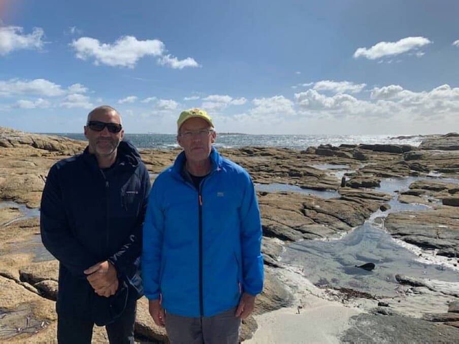 BASS STRAIT BATTLERS: Long-time Albury friends Matt Flower and Stuart Baker arrived at Flinders Island exhausted but in one piece on Wednesday after a 7.5-hour, 65-kilometre 'slog' in their double sea kayak. Picture: SUPPLIED
