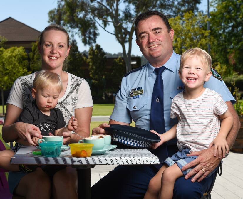 COFFEE CATCH-UP: Lauren Blatchford and her sons, Logan, 1, and Connor, 3, meet Albury Local Area commander Superintendent Evan Quarmby at the Coffee With A Cop event. Picture: MARK JESSER