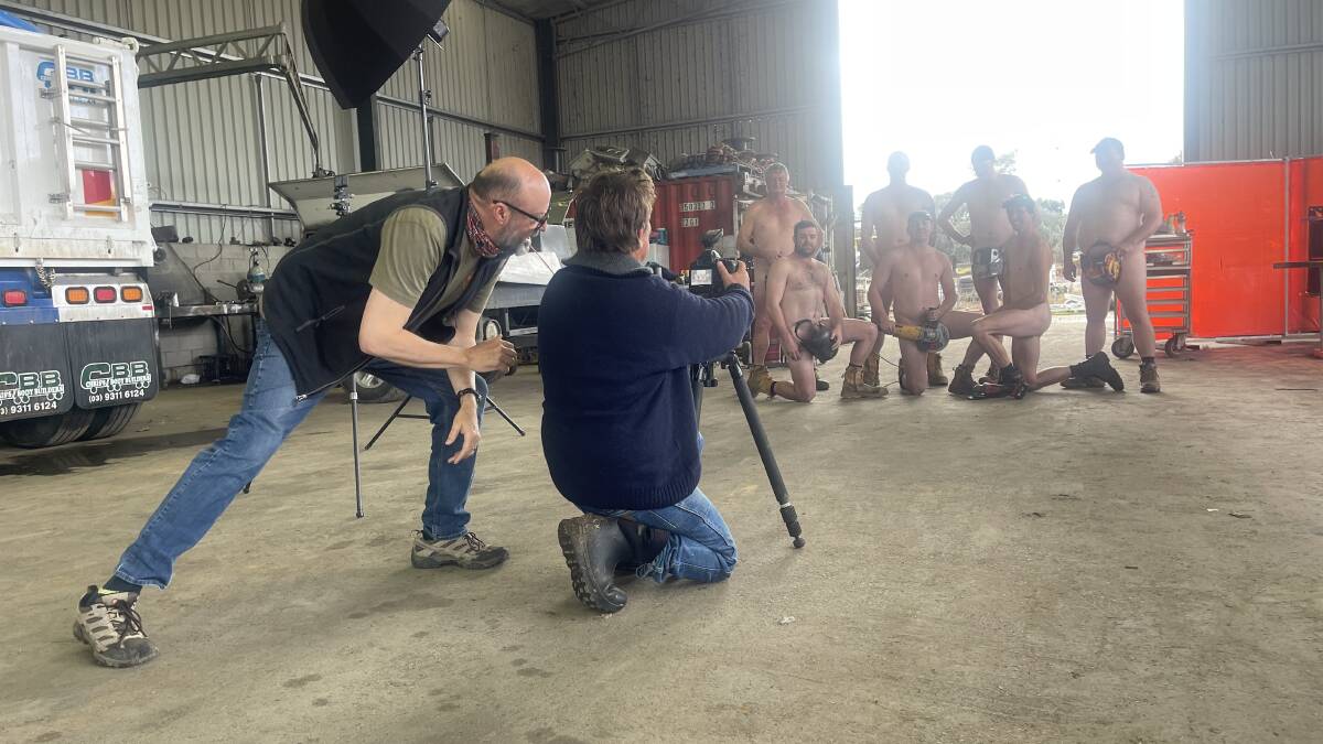 LIGHTS, CAMERA, ACTION: There was some steely resolve against the cold from the guys at Ten Mile Engineering at Holbrook during last week's photo shoot.