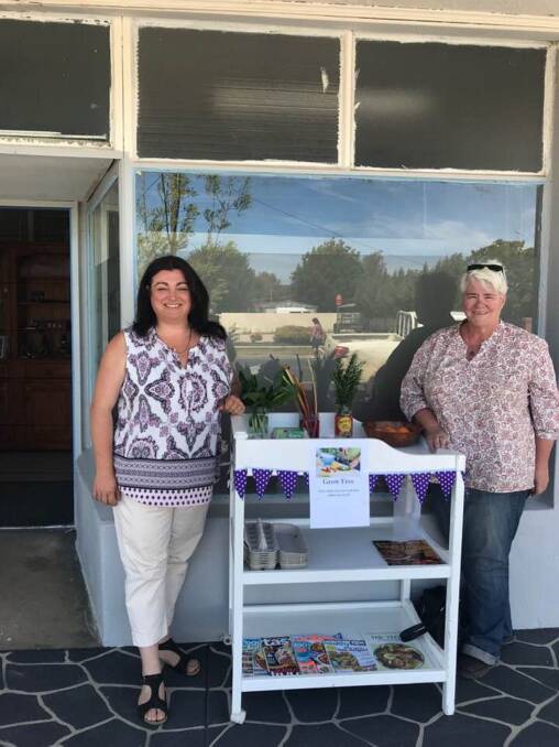 EAT, PRAY, LOVE: Country Dating owner Sarah Schmidt had moved her office to Jindera and (pictured with Carmel Excell -Cole) also has a Grow Free cart out the front for people to share and swap fresh produce.
