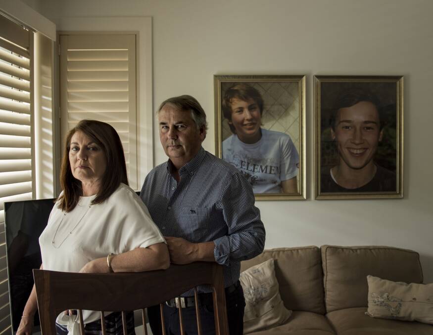 GAPING GRIEF: Solstice speakers Kathy and Ralph Kelly with photographs of their sons, Thomas and Stuart, forever lost to them. Picture: FAIRFAX