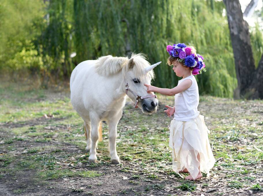 MAGICAL ENCOUNTER: Bubbly Olive Statham, 3, meets Tilly the unicorn - Olive has a rare genetic condition called Williams Syndrome.