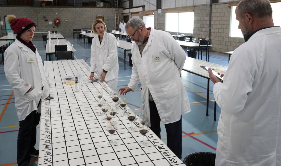 TASTE TEST: Rutherglen Wine Show chairman Chris Pfeiffer oversees judging of some of the muscat entries during four days of rigorous assessment by world-class judges. Picture: JAMES WILTSHIRE