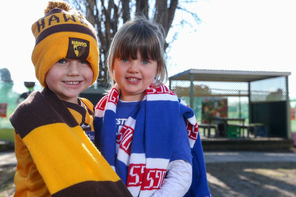UNITED COLOURS: Die-hard fan Darcy Carter, 4, with Elsie Barlow, 4, ahead of Albury Preschool's Fight Cancer with Footy Colours fundraiser.