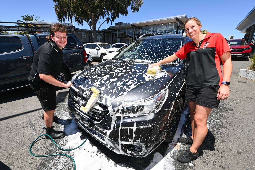 On the road to success ... Callum Smith, soon to be 17, pictured with Albury High School Teacher Danielle Cale, has landed his dream job with Baker Motors. Picture by Mark Jesser