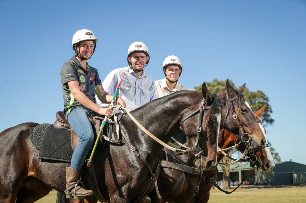 LET'S RIDE: Maya Scott, 13, Jimmy Grills and Thomas Wilms,14, warm up for this week's polocrosse carnival in Albury. Picture: JAMES WILTSHIRE