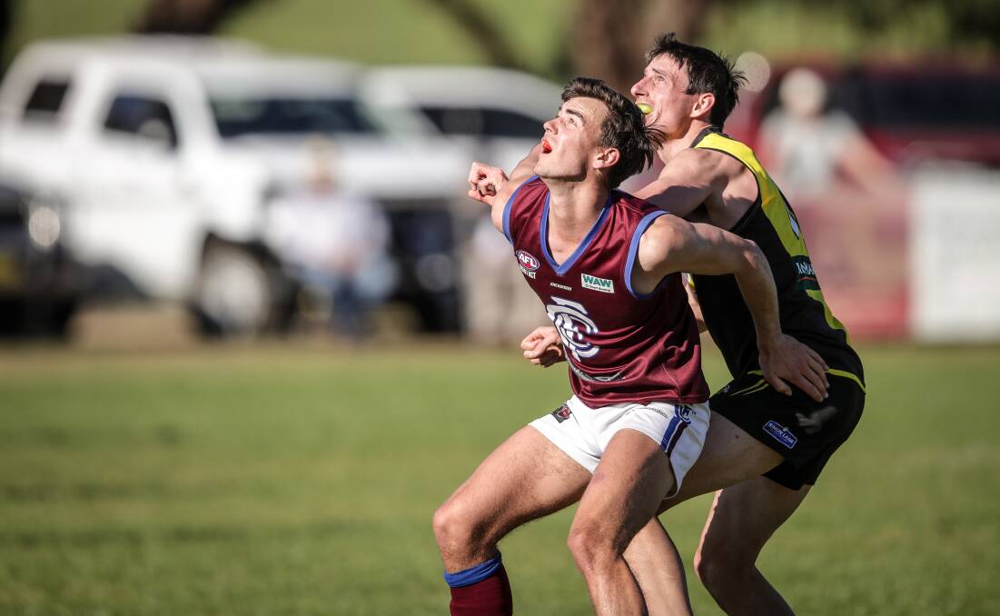 Culcairn's James Pitson and Tiger defender Duncan McMaster jostle for position at Walbundrie on Saturday.