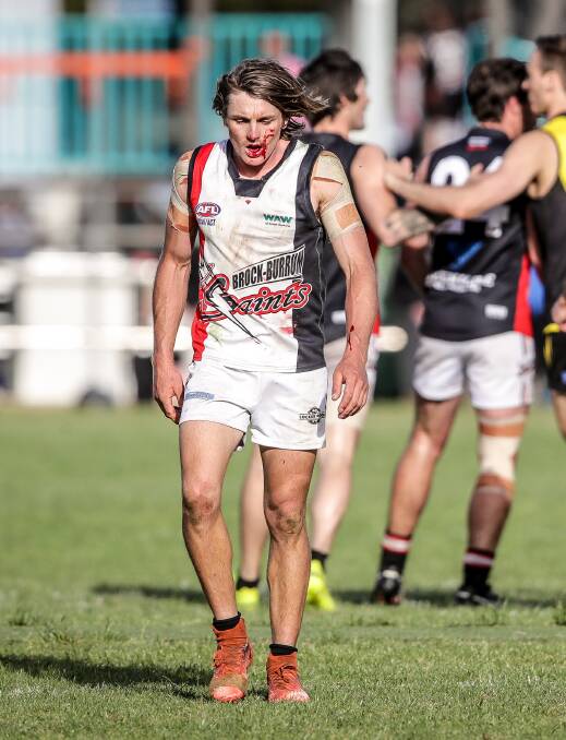A bloodied Nico Sedgwick leaves the ground on Saturday.