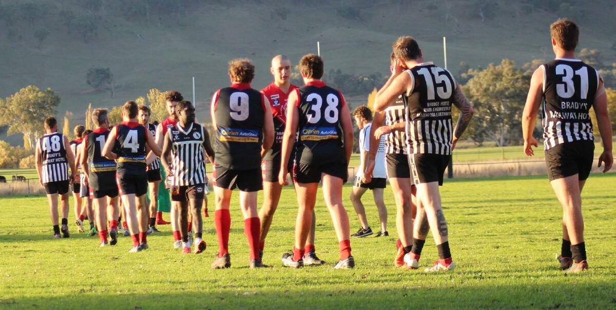 Corryong and Border-Walwa players shake hands after the final siren at Walwa on Saturday. Picture: DEB HARRAP