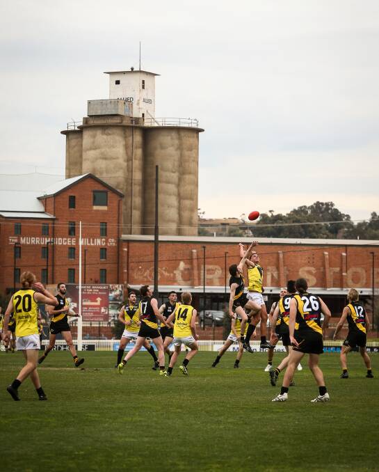 BACK IN BUSINESS: Osborne and Wagga Tigers go at it during the AFL Riverina Chamionship's opening round at Wagga's Robertson Oval Pictures: JAMES WILTSHIRE