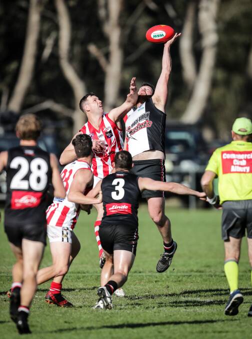 OUT: Brock-Burrum ruckman Matt Seiter contests a hit-out against Swampie Chris Willis during last weekend's fiery tussle at Brocklesby. Picture: JAMES WILTSHIRE