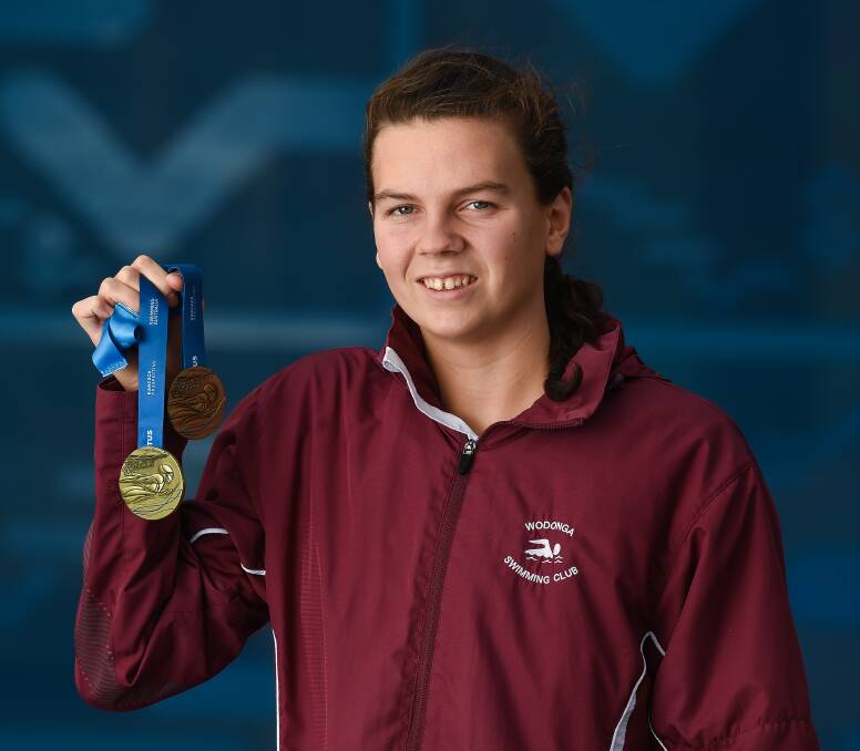 REWARD FOR EFFORT: Wodonga's Zoe Deacon stunned her rivals in the girls breaststroke. Picture: MARK JESSER