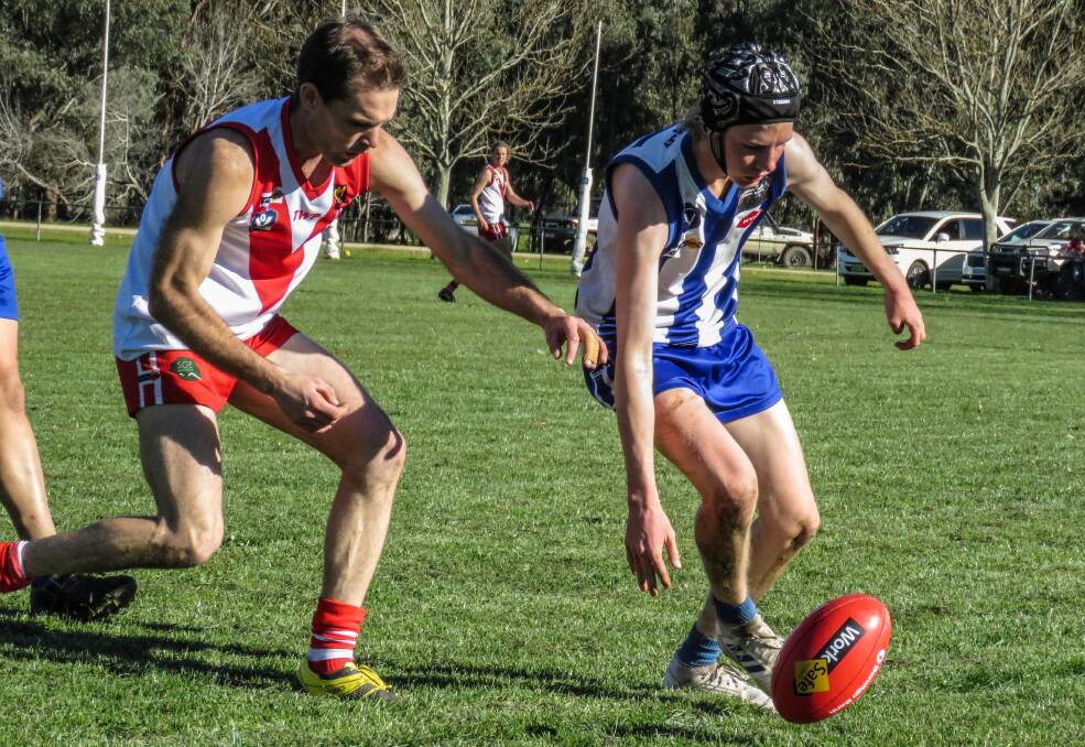 Tumbarumba's Darcy Rixon leads in the race for the ball against Federal on Saturday. Picture: WENDY LAVIS