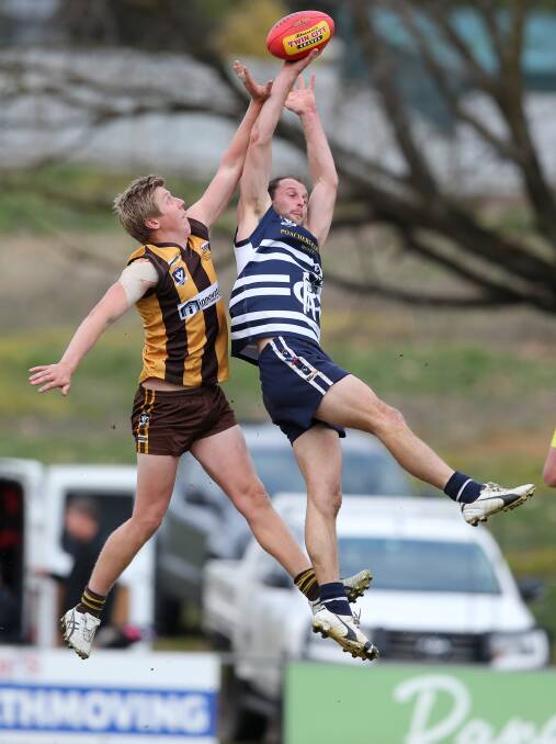 FLYING HIGH: Hawk Caleb Beattie and Rutherglen's Sam Fiedler soar for a mark on Saturday. Pictures: KYLIE ESLER