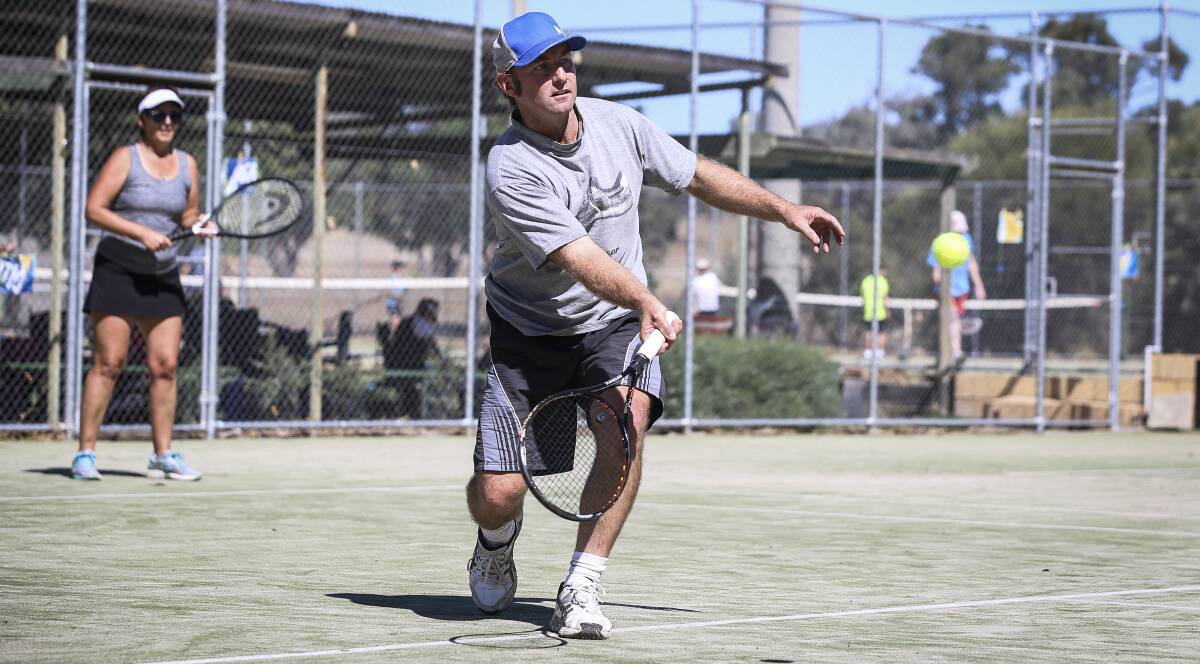 CENTRE COURT: Brad Schulz in action with Janelle Peacock during Burrumbuttock's mixed doubles tournament. Picture: JAMES WILTSHIRE