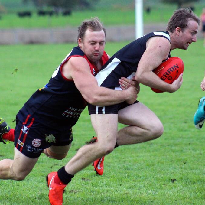 Border-Walwa's Myall Hoffmann attempts to break a tackle against Corryong on Saturday. Hoffmann was the Magpies best player in the 116-point loss. Picture: DEB HARRAP