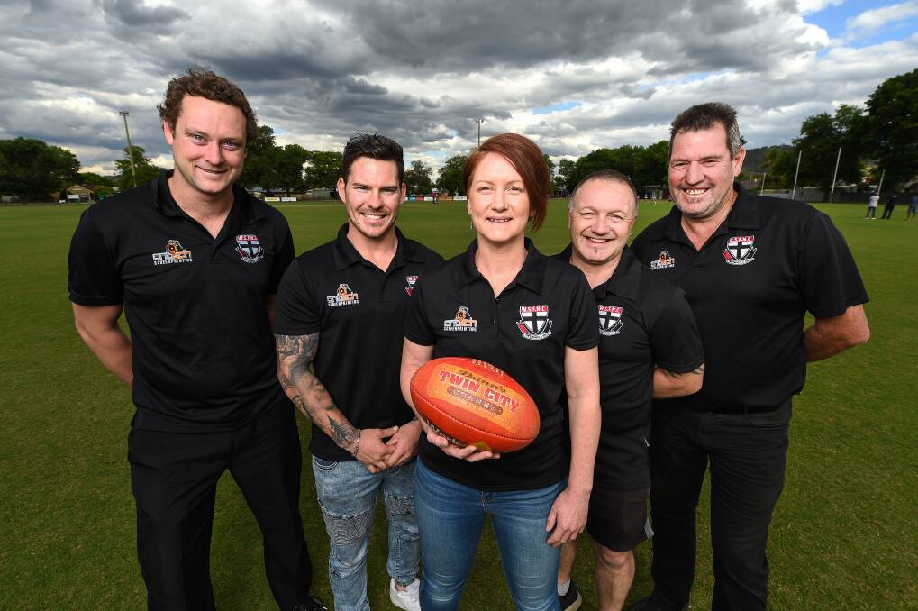 Wodonga Saints' new reserve grade assistant-coach Claire Cartwright with senior players Cameron Gilchrist and Haydn Cook, reserve grade coach Troy Vennix and senior coach Gerard Midson. Picture: MARK JESSER