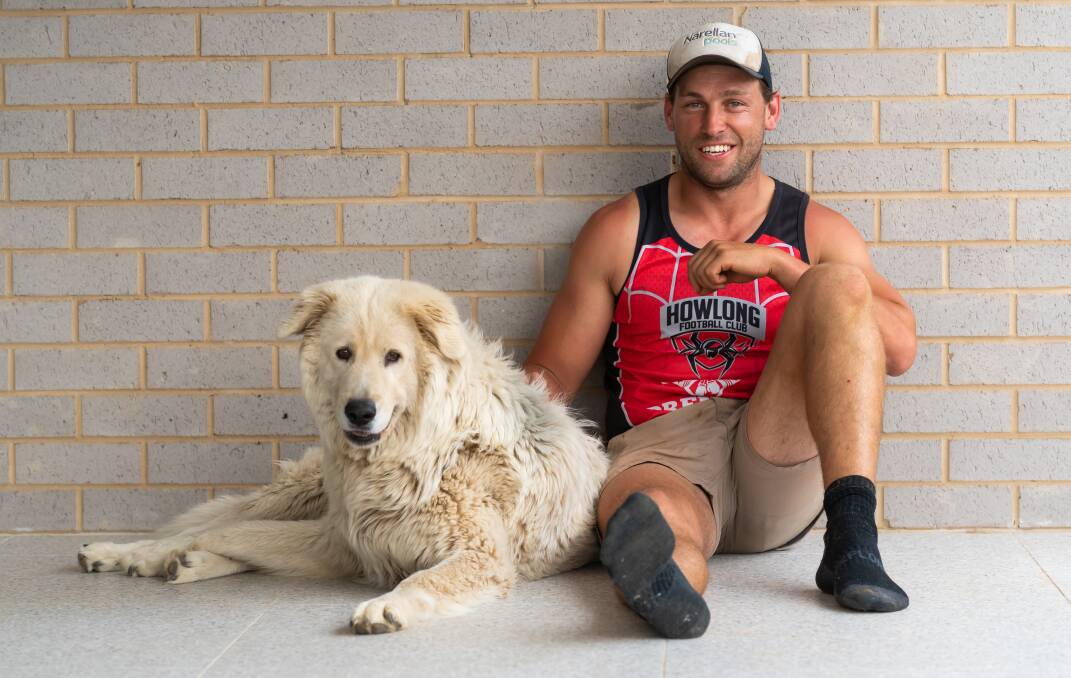 Howlong's Brad Farrugia, with his dog Bont, started training with his Spider teammates earlier this month. Picture: MARK JESSER