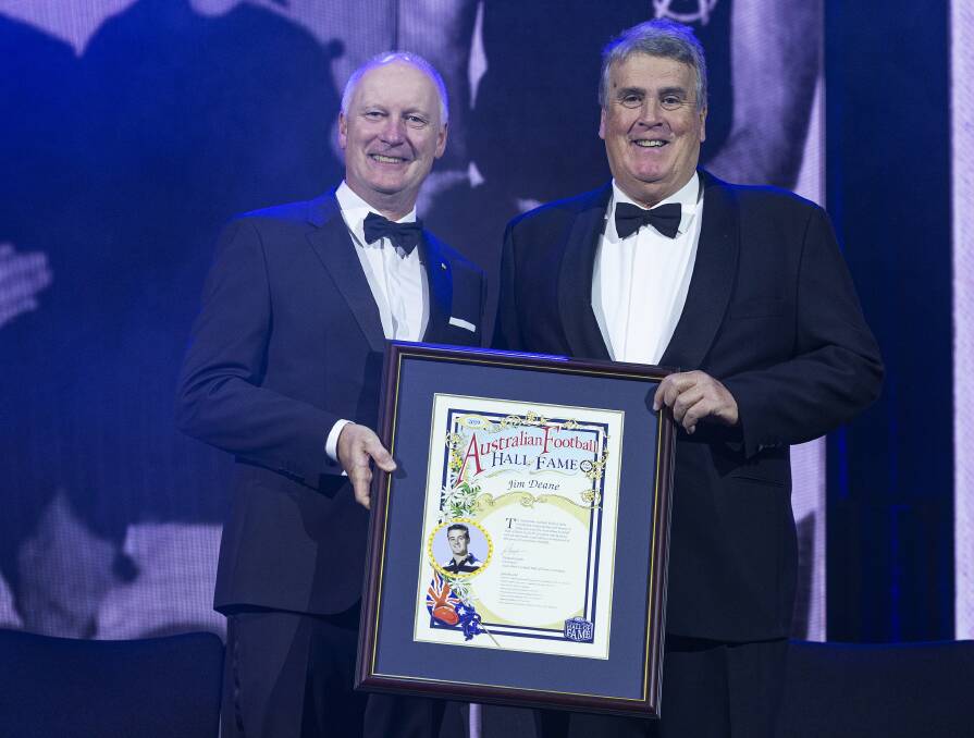 Michael Deane (right) accepts Jimmy's induction from AFL
commission chairman Richard Goyder on Tuesday.