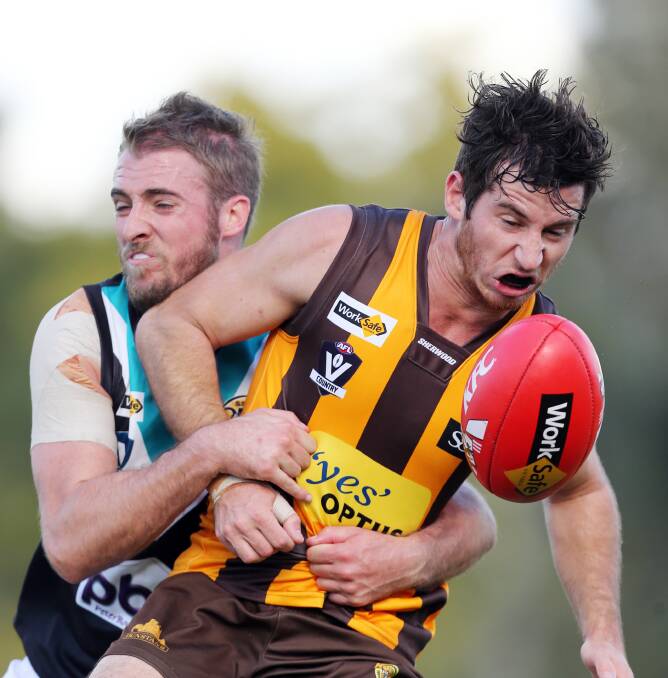 Hawk Mitch Booth came off second best in an accidental clash with Wangaratta's Joe Richards.