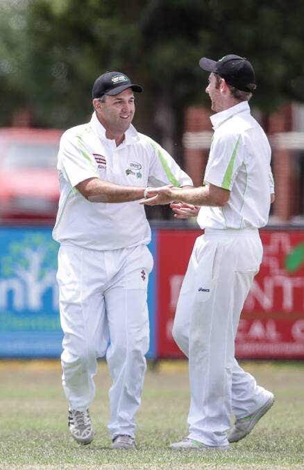 Kane Arendarcikas and Matt Crawshaw celebrate a wicket on Sunday.