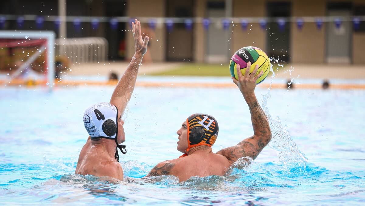 Tiger Mitch Dempsey and Pool Pirates' Grant Meredith do battle in their A grade clash at Wodonga on Sunday. Picture: JAMES WILTSHIRE