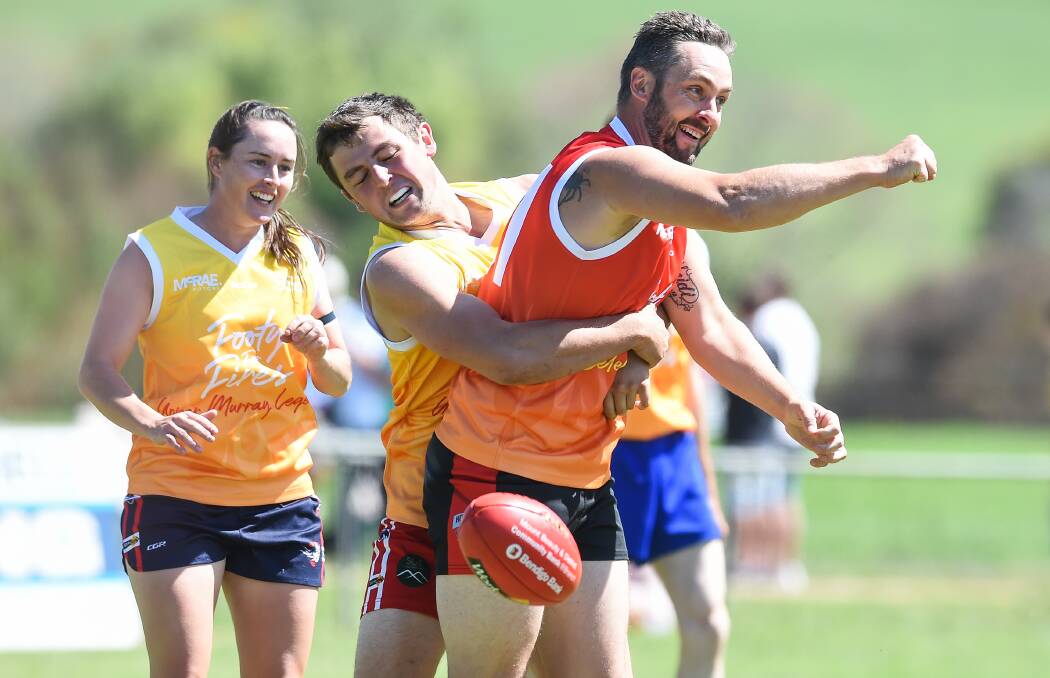 All Stars defender Andrew Reid unsuccessfully tries to barge his way through a pack. The Legends ran-out victors by three goals.