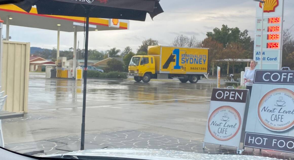 Talking point: The A1 removals truck from Sydney which stopped on Friday at the same Jindera petrol station where infected removalists visited last Saturday.
