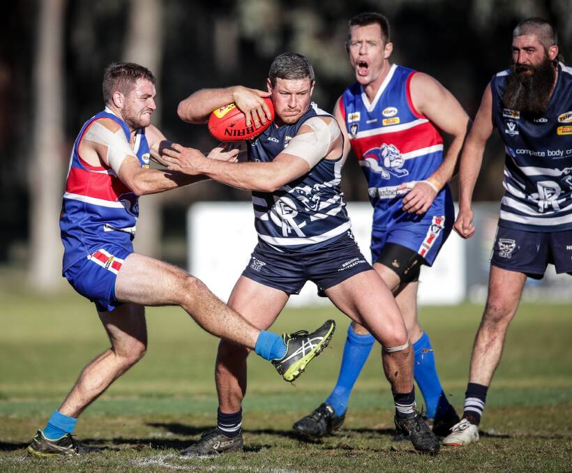 Rutherglen's Jarrad Farwell attempts to bust a pack against Thurgoona last weekend. He is keen to return to home club Henty.