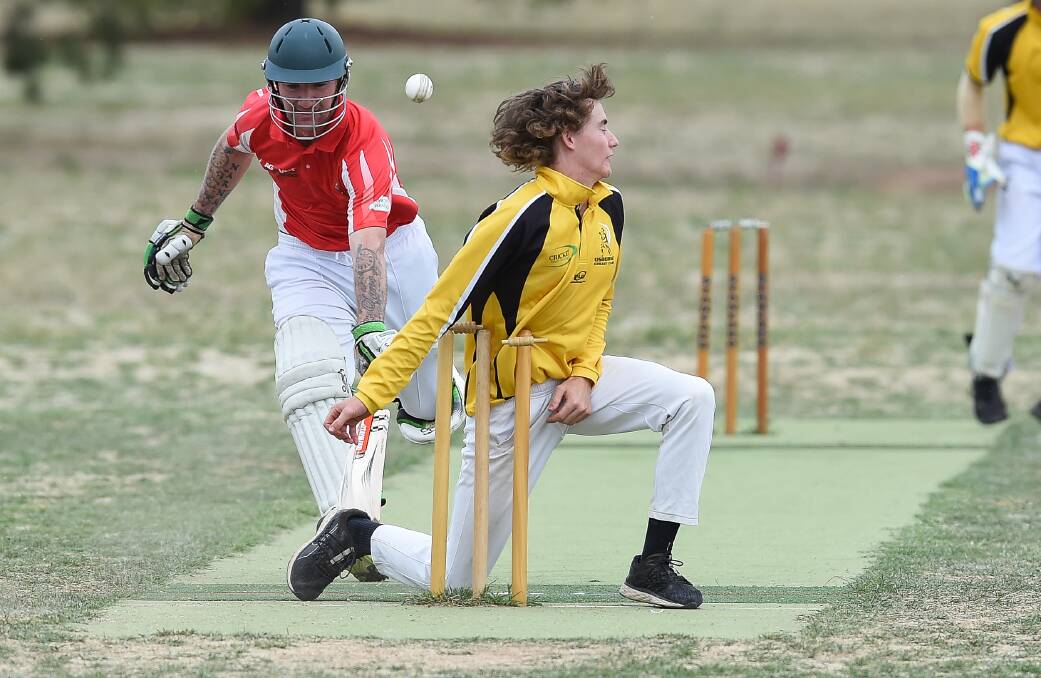 Osborne all-rounder Ed Perryman attempts to run out Henty batsman Grant Gardiner at Henty on Saturday. Gardiner topscored for the Swampies with 49. Picture: MARK JESSER