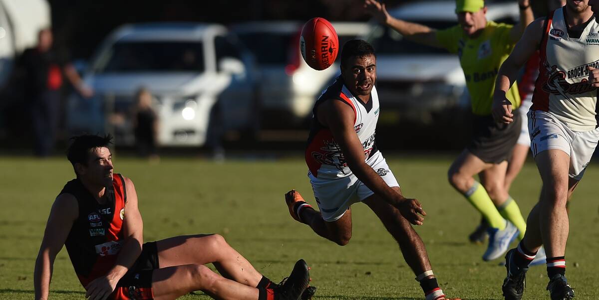 Saint speedster John-Roy Williams keeps his feet under pressure during the reigning premier's 91-point win over Howlong.