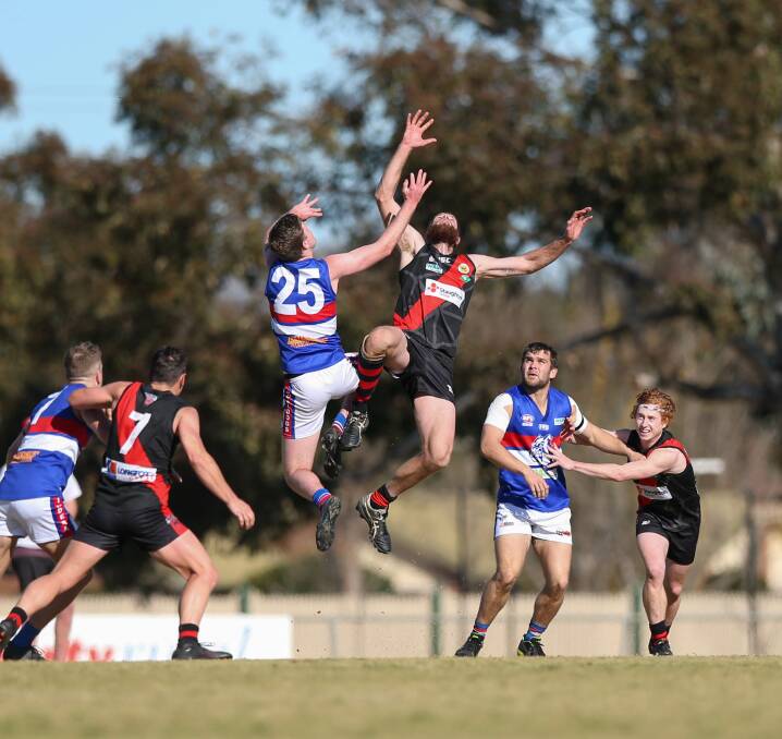 Jindera's Mitch Lawrence and Spider Peter Hancock had an epic battle in the ruck at Howlong on Saturday. Picture: TARA TREWHELLA