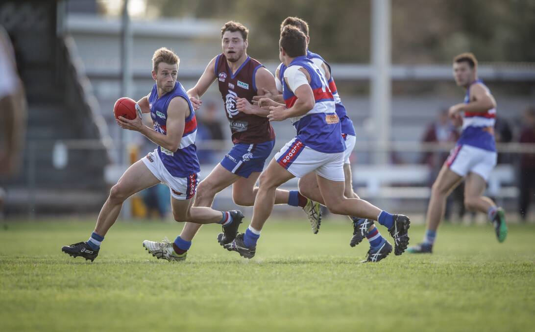 Bulldog Joel Klemke breaks clear of a pack at Culcairn. The Lions have won three of their opening five matches.