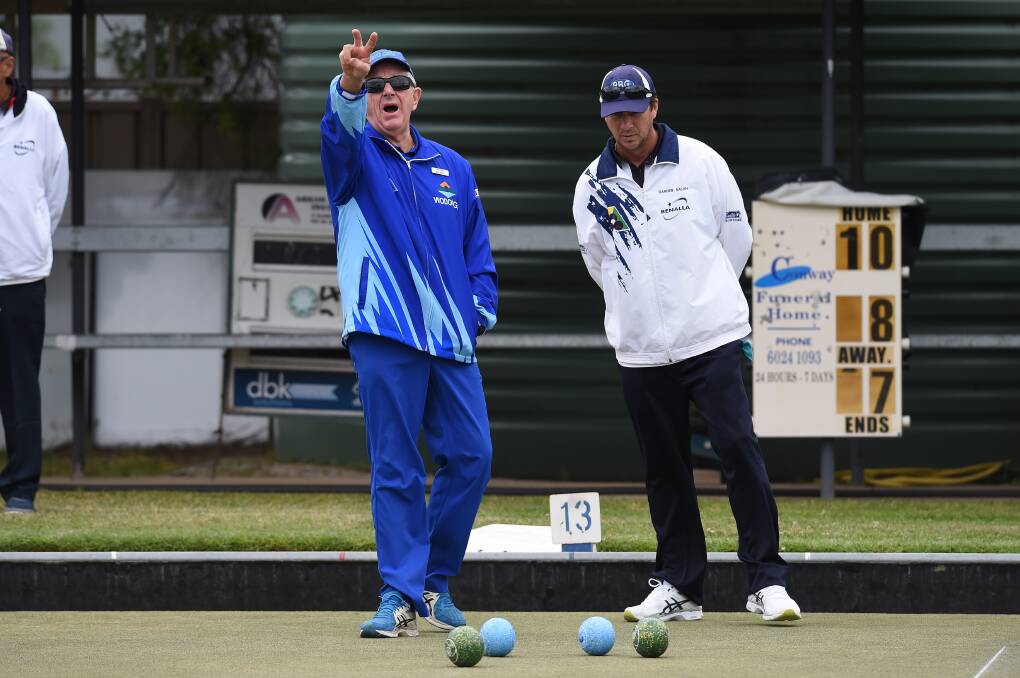 Wodonga bowler Peter McLarty sums up the situation as Benalla's Darren Salan looks on in A! pennant on Saturday. Pictures: MARK JESSER