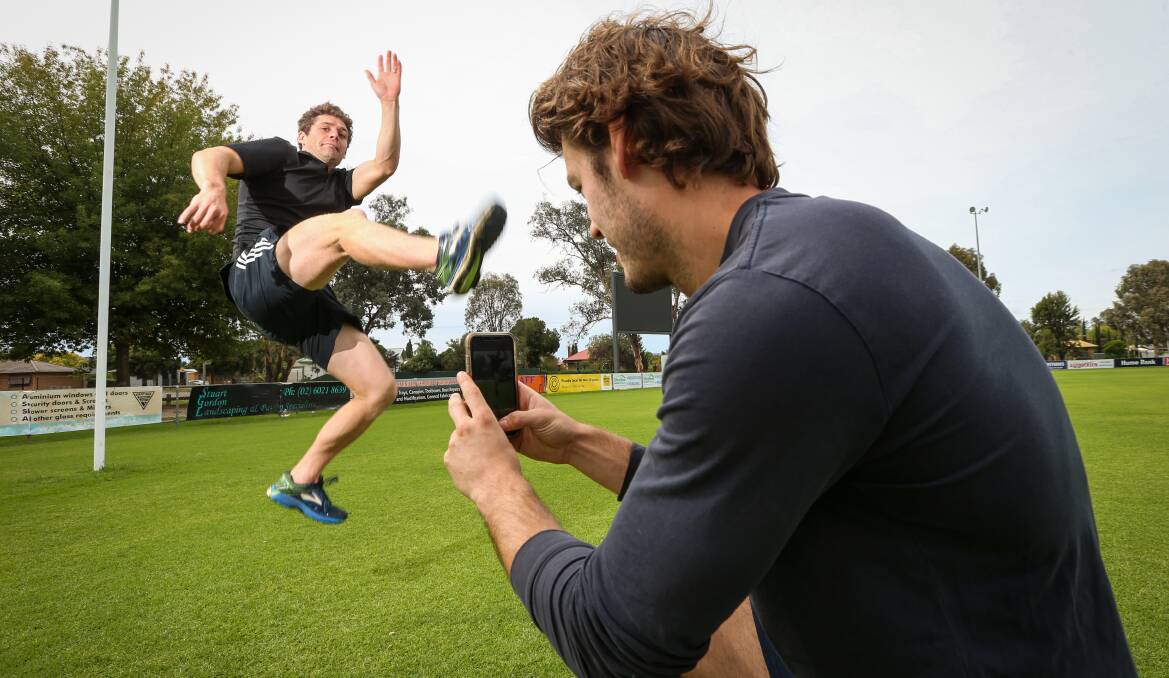 STAYING ACTIVE: Trinity Anglican College's David Miles and Jacob Cincurak have been busy filming challenges. Picture: JAMES WILTSHIRE