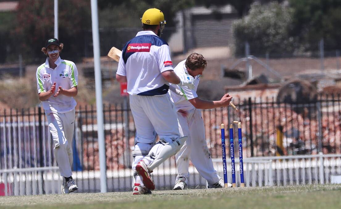 CAW Hume's Mark Kreutzberger runs out Wagga opener Ethan Perry much to the delight of young spinner Ed Perryman. Picture: DAILY ADVERTISER