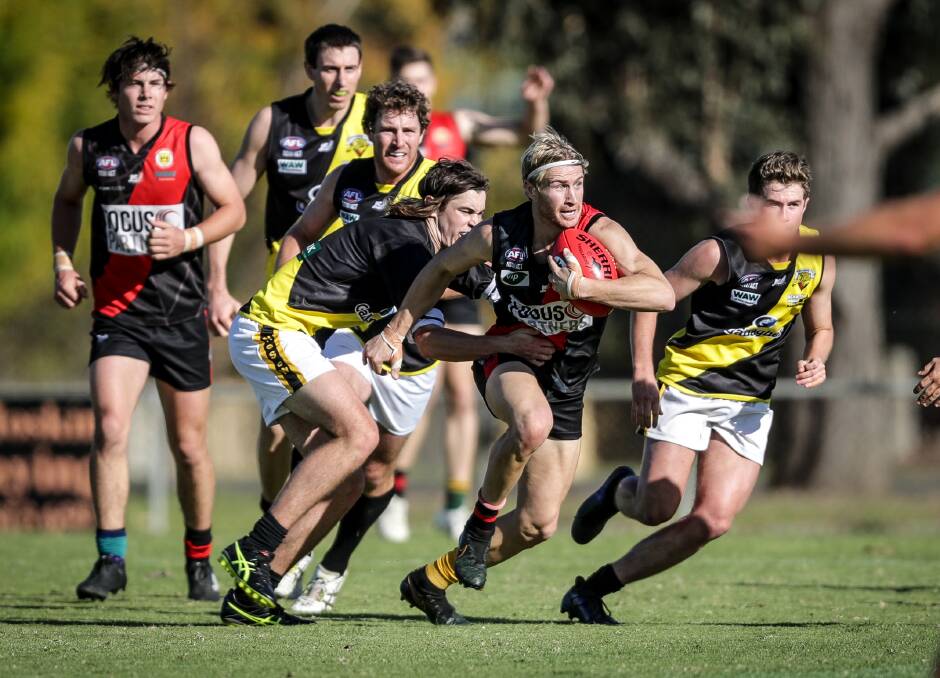 Howlong's Steve Jolliffe bursts clear of a pack. The Tigers notched up another comfortable victory.